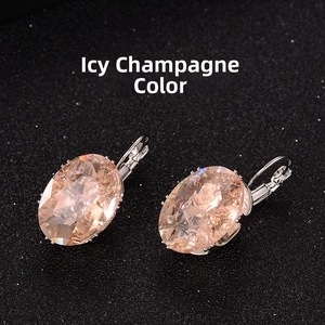 Detail of oval champagne earrings with ice flower texture and silver metal ear hooks