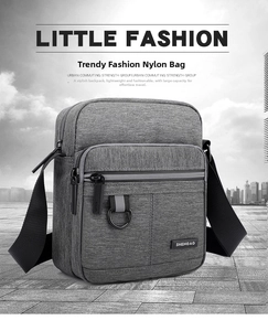 Detailed view of the water-resistant grey nylon messenger bag with multiple zipper pockets