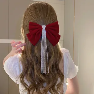 Elegant red velvet bow hair clip with long sparkling rhinestone tassels for women