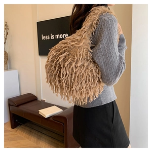 Khaki tassel plush shoulder bag shown on model for a trendy autumn and winter style