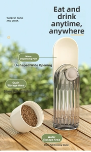 Close-up of portable pet water bottle on wood table with integrated food storage compartment