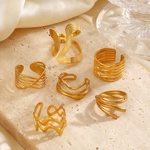Set of minimalist 18K gold plated stainless steel rings with organic wavy designs