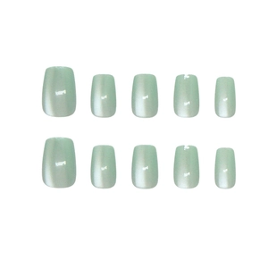 Mint green cat eye press-on nails with shimmering finish in short square shape