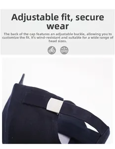 Detail of navy blue cotton baseball cap with adjustable silver metal buckle and strap
