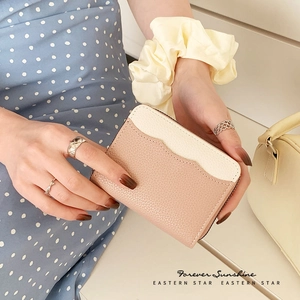 Pebble grain leather wallet with zip closure and two-tone minimalist design for women