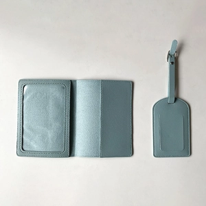Light blue PU leather passport holder and luggage tag set shown on a white background