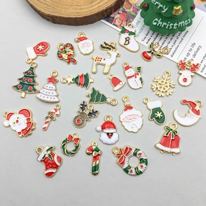 Detailed collection of assorted Christmas enamel charms including Santa, elk, and trees