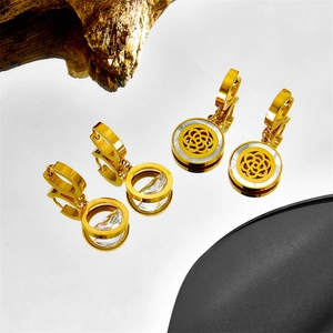 Elegant gold hollow stainless steel hoop earrings with black shell round pendant for women