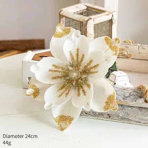 Detailed view of a 24cm white velvet Christmas flower with golden glitter accents