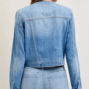 Back view of light blue cropped denim jacket with contrast stitching and washed finish