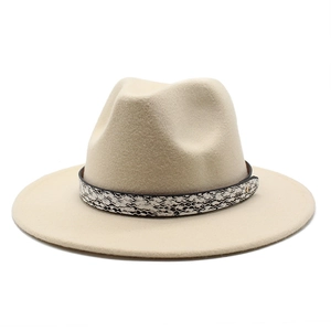 Close-up of beige felt fedora featuring snakeskin patterned band and small gold buckle detail