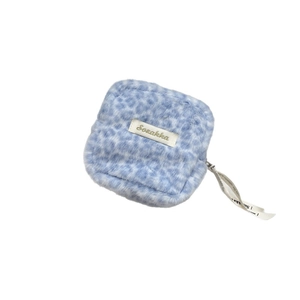 Blue leopard plush sanitary pouch with Sozakka label and lettered ribbon handle