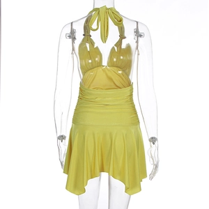 Detailed close-up of yellow halter dress featuring ruffled bodice and ruched waistline