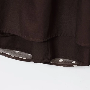 Fashionable dark brown layered blouse with stylish polka dot lining and professional stitching