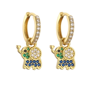 Macro view of gold hoop earrings with vibrant multi-color crystal elephant charms
