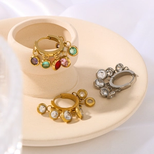Minimalist stainless steel hoop earrings with colorful zircon tassels on ceramic props
