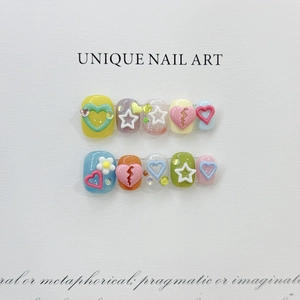 Detailed macro view of 10-piece handmade 3D press-on nails with resin heart and star charms