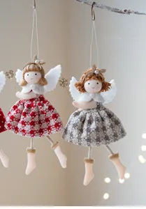 Detail of Christmas angel hanging ornaments with checkered skirts and golden wands