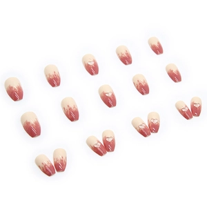 Pink and white gradient press-on nails with 3D heart charms in a ballet short shape