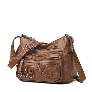 Brown woven PU leather crossbody bag with multiple zip pockets and adjustable strap