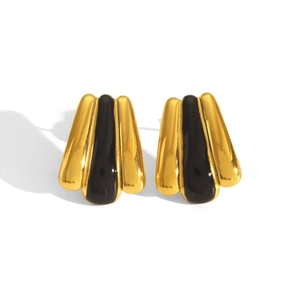 Macro shot of 18k gold plated fan earrings with black enamel and striped texture