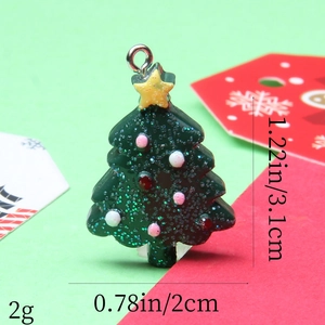 Detail view of a green resin Christmas tree pendant with precise size and weight dimensions