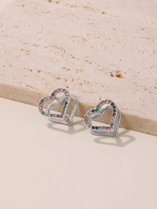 Detailed view of double heart hoop earrings with colorful zircon inlay and silver finish