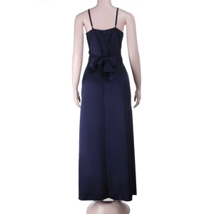 Detail of the navy blue satin dress showing the back ribbon bow and elegant slit hem
