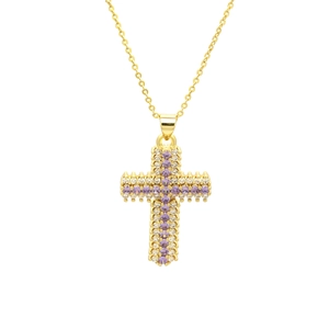Macro shot of gold cross pendant featuring purple and white zircon gemstone pavé detail