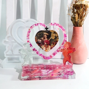 DIY heart-shaped resin photo frame mold with cupid angels and dried flowers detail