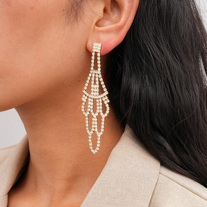 Luxurious gold-plated fan-shaped tassel earrings with sparkling rhinestones on model