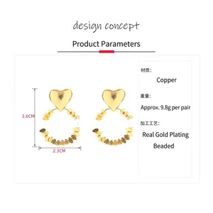 Elegant gold heart-shaped beaded hoop earrings with pearls and size measurement detail