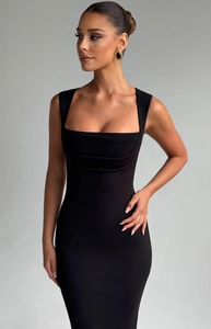 Detail of square neckline and pleated texture on a slim fit black sleeveless dress
