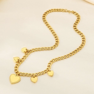 Golden heart pendant necklace with thick Cuban link chain and lobster clasp