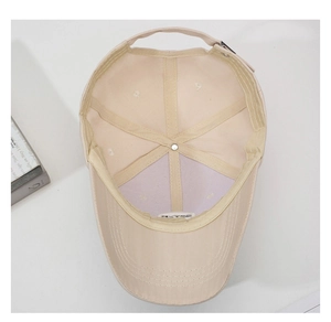 Detailed interior of the baseball cap featuring a sweatband and adjustable metal buckle