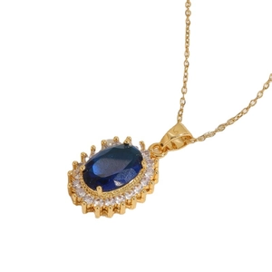 14K gold plated necklace featuring a sparkling oval blue resin pendant with zircon halo
