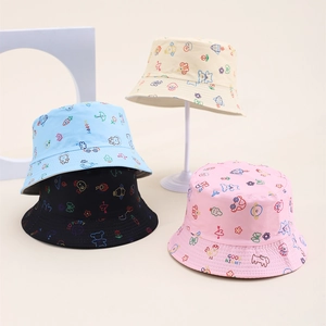 Detail of colorful cartoon animal prints on assorted kids cotton bucket hats for sun protection