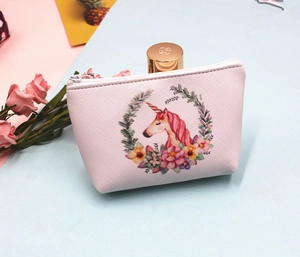 Detail of pink unicorn coin purse with cross-grain texture and secure zipper closure