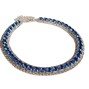 Elegant silver choker necklace featuring blue rectangular crystals and clear rhinestones