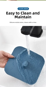 Close-up of blue silicone floor drain cover being washed under running water