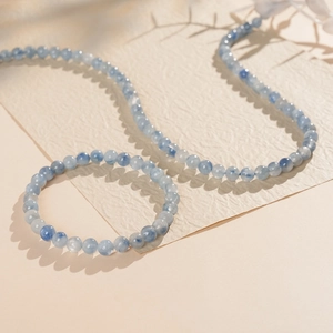 Detailed view of blue kyanite beaded bracelet and necklace with natural stone textures