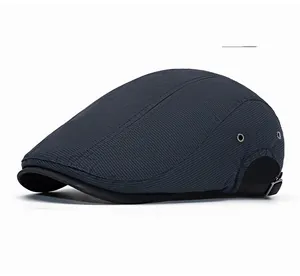 Detail of dark gray ivy cap featuring side metal eyelets and adjustable rear buckle