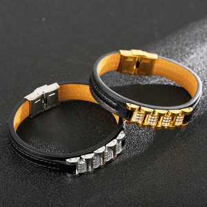 Detail of CZ-encrusted stainless steel watchband buckle on a black leather bracelet