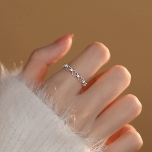 Elegant S925 sterling silver hollow heart ring with sparkling crystals for women