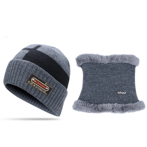 Detail view of gray knitted winter hat and fleece-lined neck warmer set with classic labels