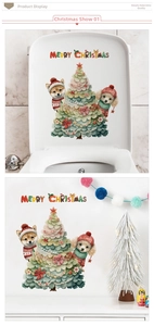 Christmas tree and dogs wall stickers applied on toilet lid and white wall surfaces