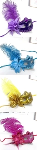 Detail of masquerade masks with ostrich feathers in purple, blue, gold, and rose red colors