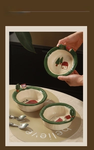 Detailed view of handmade ceramic dessert bowl with 3D miniature house and tree design