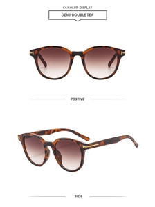 Detail of tortoise shell sunglasses with gold T-shaped metal hinge and tea lenses