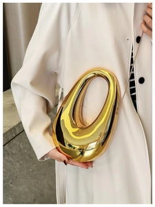 Fashionable gold asymmetrical oval acrylic clutch bag with shiny metal chain strap for women